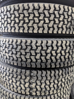 More commercial truck tires stacked on top of one-another. Again, the emphasis is on the tread, which is more complex with zig-zags compared to the prior photo. The photo showcases the amount of commercial truck and trailer tires available in Glenwood and Council Bluffs, IA at CFI Tire Service 